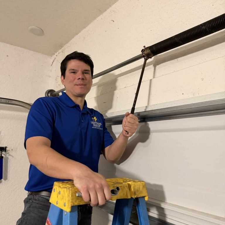 an image of ken the owner of lightning fast garage door repair performing garage door repair in cape coral